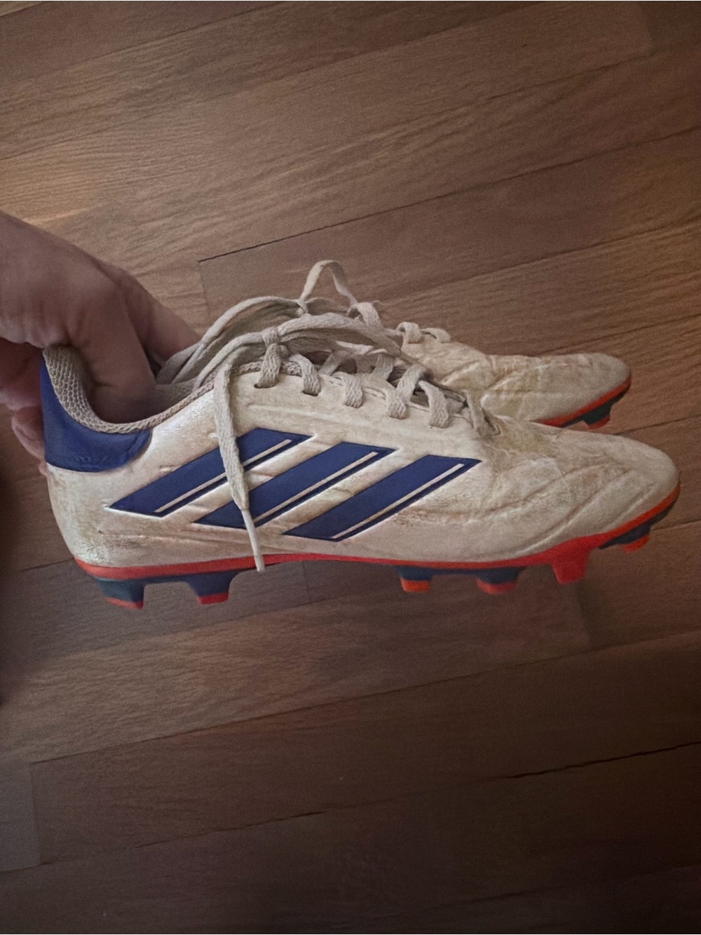 adidas Kids White Soccer Cleats with Blue Stripes and Orange Accents